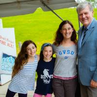 President Haas posing with guests at the Jamie Hosford Football Center dedication.